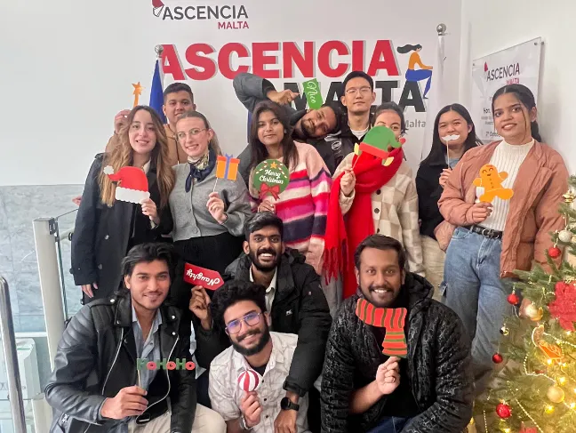 Ascencia Malta students celebrating the festive season with Christmas-themed props