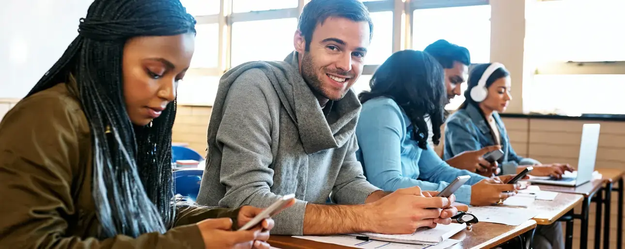 Students studying together in a classroom during an Ascencia Malta FCE (First Certificate English) preparation course, developing English language and communication skills.