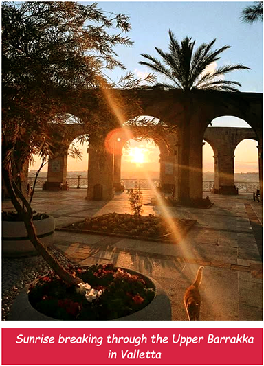 Sunrise breaking through the Upper Barrakka in Valletta
