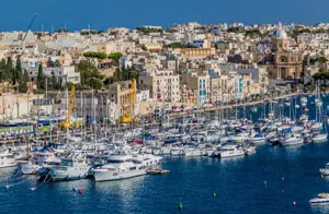 Boats and yachts docked at Kalkara Marina overlooking the waterfront in Malta.