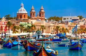 Traditional colourful fishing boats in Marsaxlokk Harbour, Malta's largest fishing village.