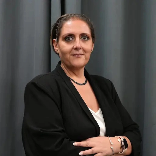 Cerise Galea, Assistant Director of Studies at Ascencia Malta, in a professional portrait with folded arms